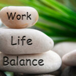 Work life balance text engraved on white stones. Work, lifestyle and life balance concept.