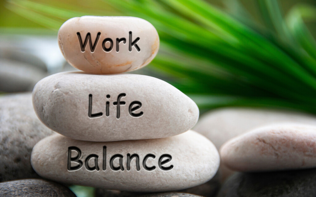 Work life balance text engraved on white stones. Work, lifestyle and life balance concept.